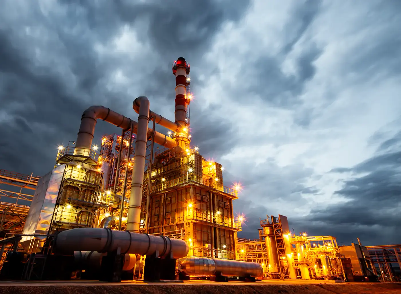 Oil refinery at dusk – Tawkok petroleum trading